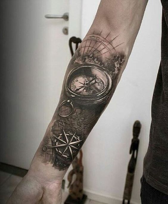Compass Over an Antique Map forearm tattoo Tattoo on skin