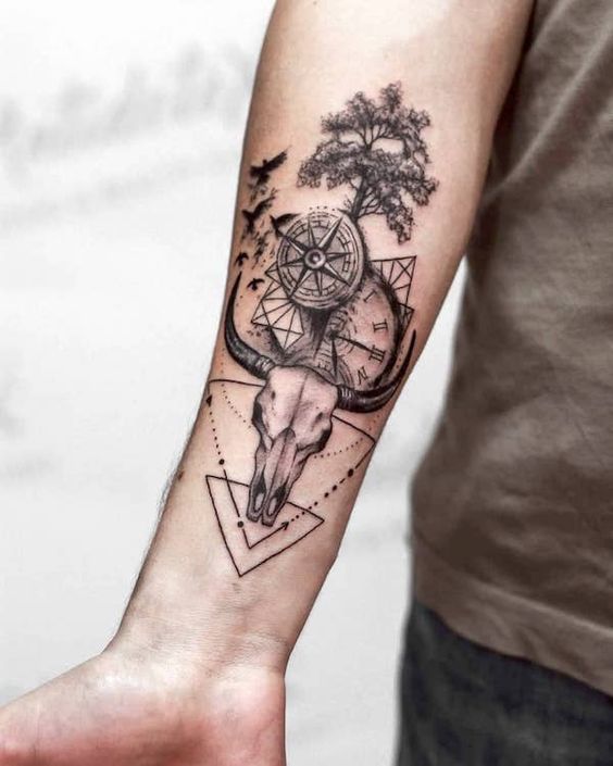 Geometric Cow Skull and Compass forearm tattoo Tattoo on skin