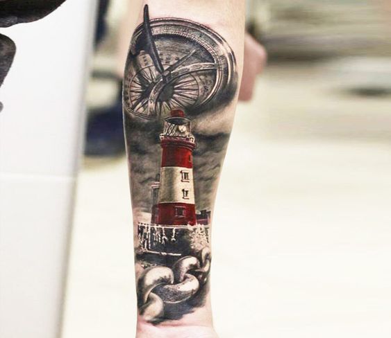 Old Lighthouse with Chain and Compass forearm tattoo Tattoo on skin