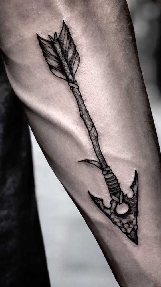 Primitive Black and White Arrow forearm tattoo Tattoo on skin