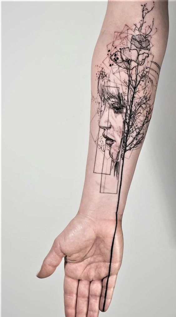 Profile of a Woman and Flowers forearm tattoo Tattoo on skin