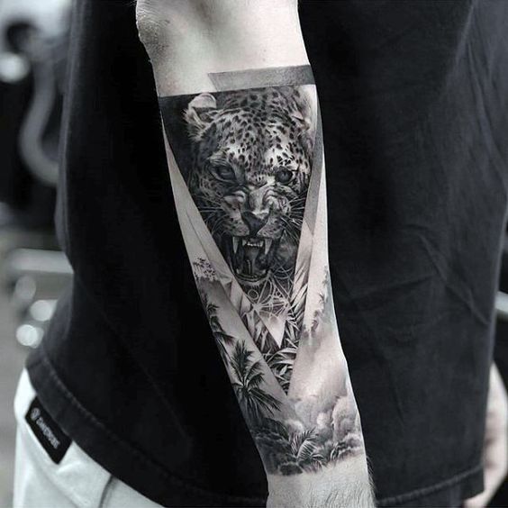 Snarling Leopard Over a Jungle forearm tattoo Tattoo on skin