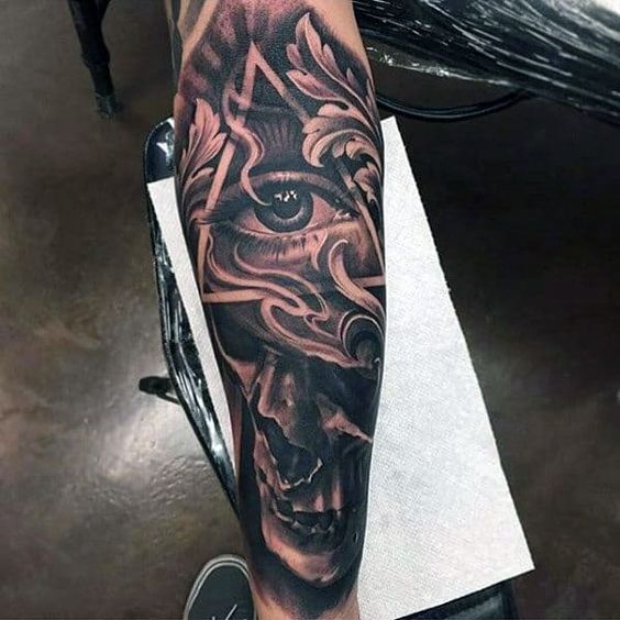 The Eye of Providence and Filigree forearm tattoo Tattoo on skin
