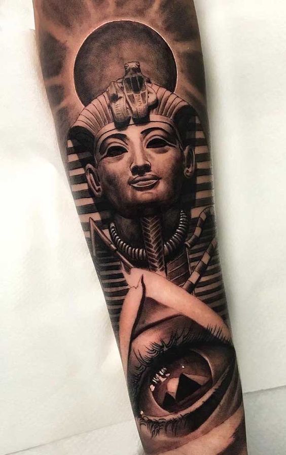 Tutankamun's Burial Mask Over the All-Seeing Eye forearm tattoo Tattoo on skin