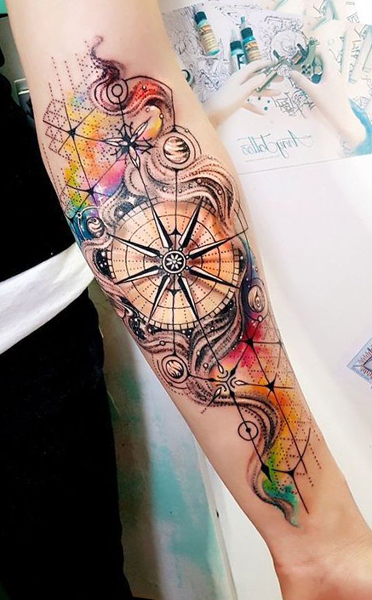 Watercolor Compass Rose with Planets Tattoo on skin