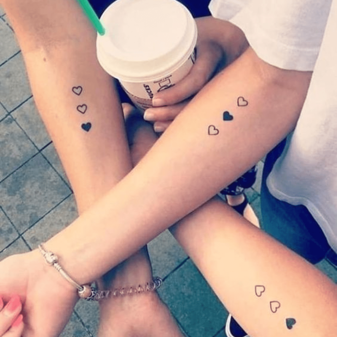 Simple Solid and Outlined Stacked Hearts Best Friend Tattoos Tattoo on skin