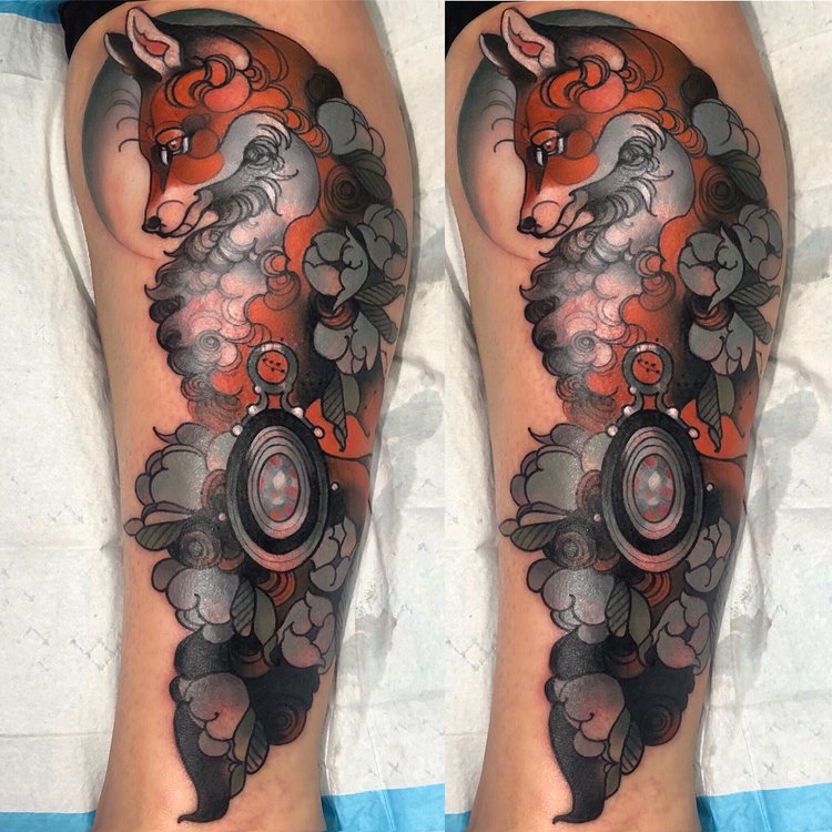 A Fox, A Locket, and Foliage Tattoo on skin