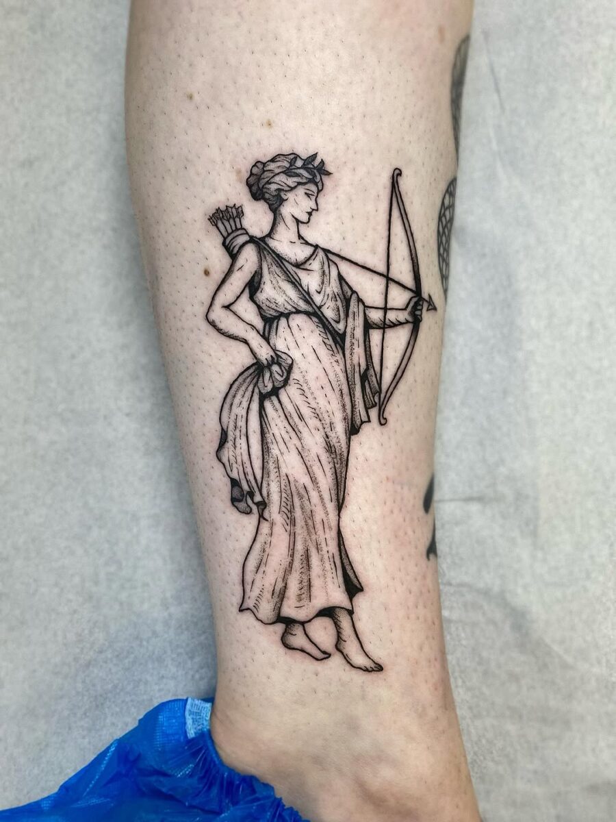 Elegant tattoo of a Greek goddess archer Tattoo on skin