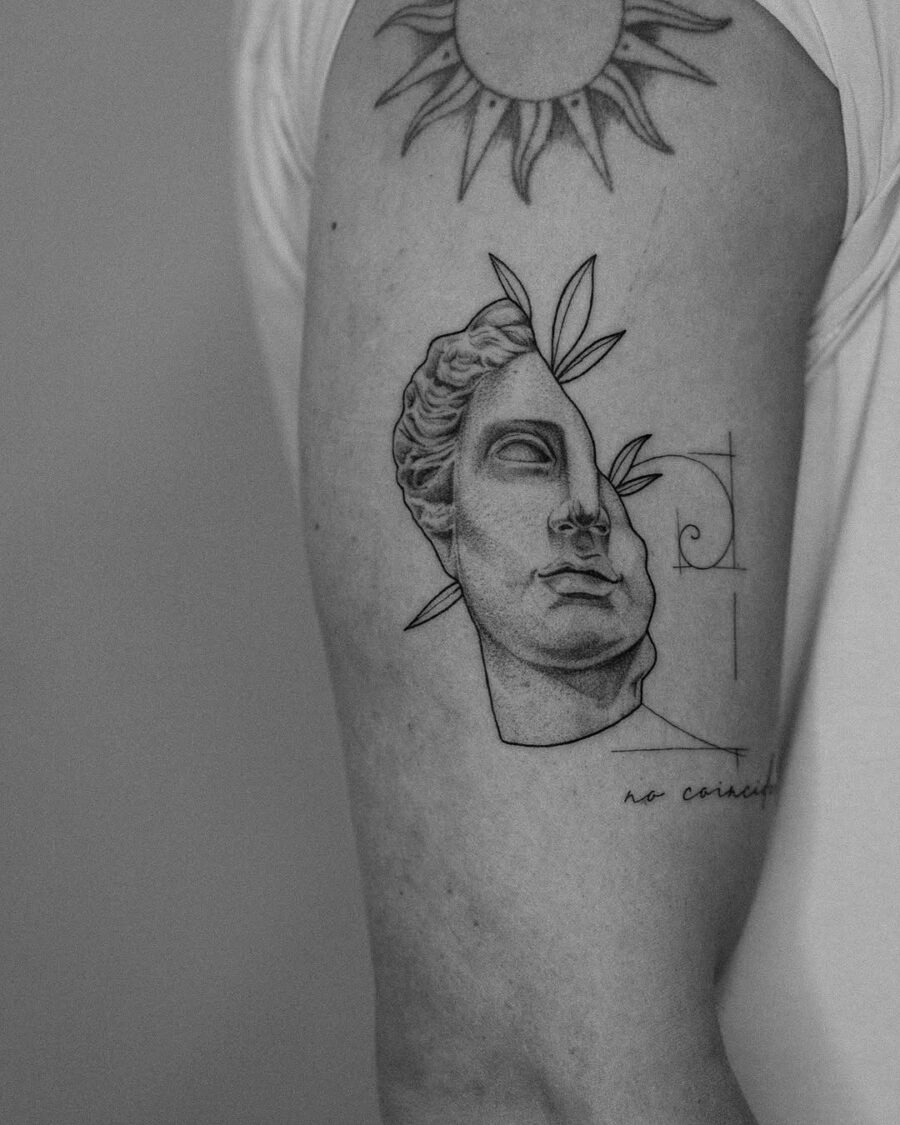 Intricate Greek god tattoo with sun detail Tattoo on skin