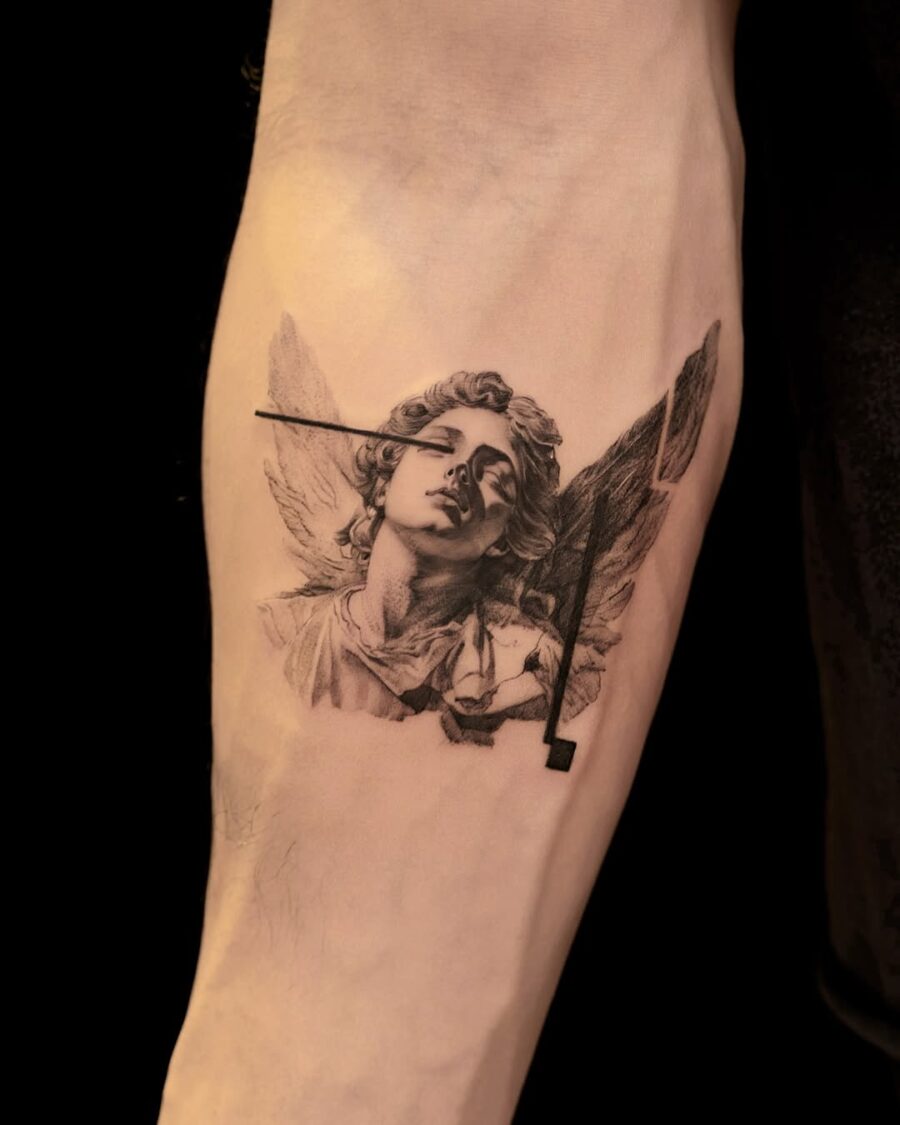 Stunning angelic figure tattoo in monochrome. Tattoo on skin