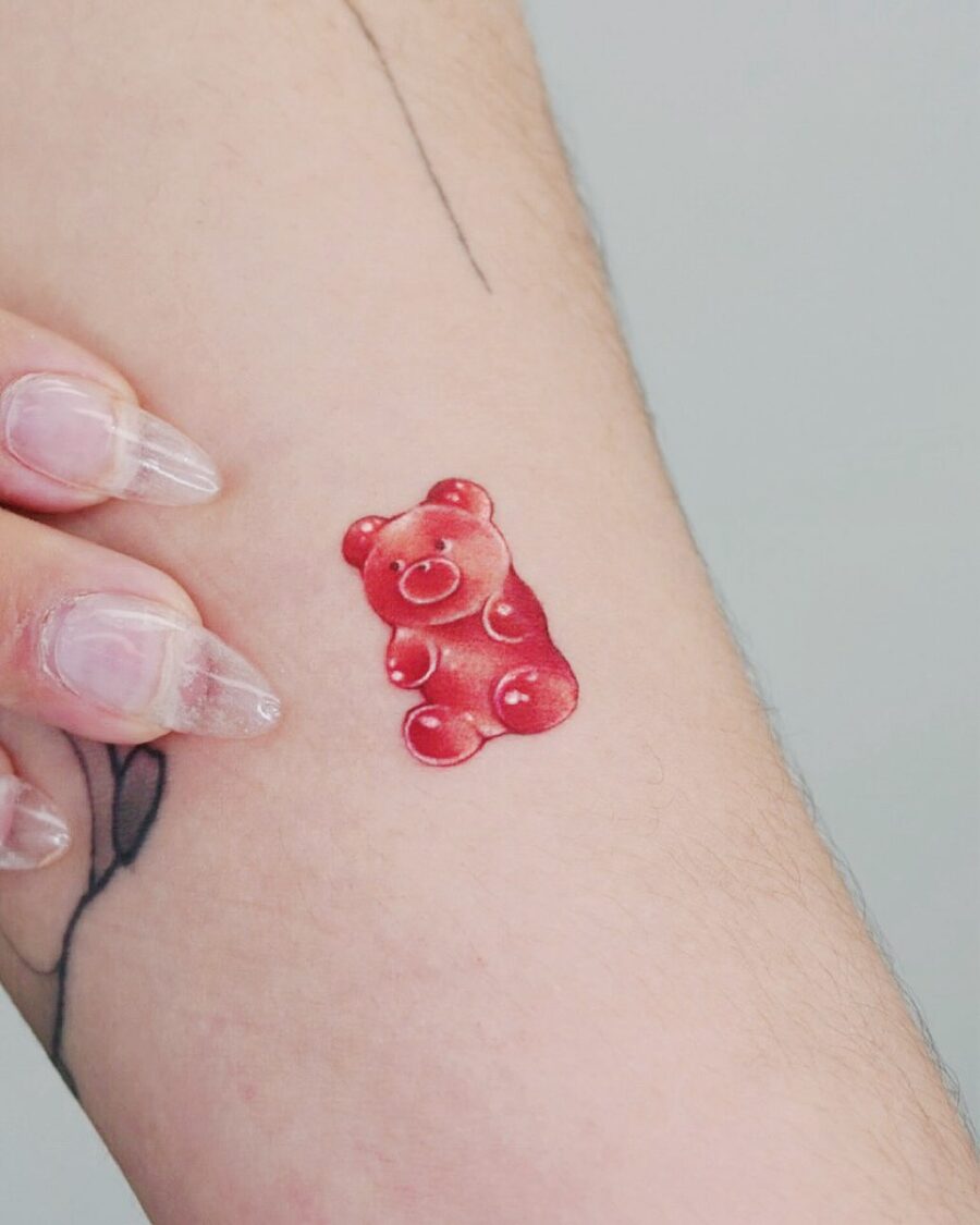 Cute gummy bear tattoo on a forearm Tattoo on skin