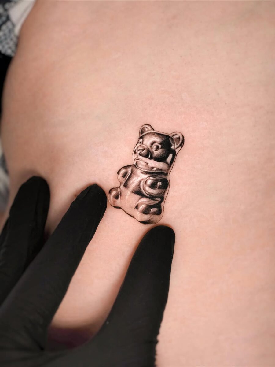 Realistic Gummy Bear Tattoo in Black Ink Tattoo on skin