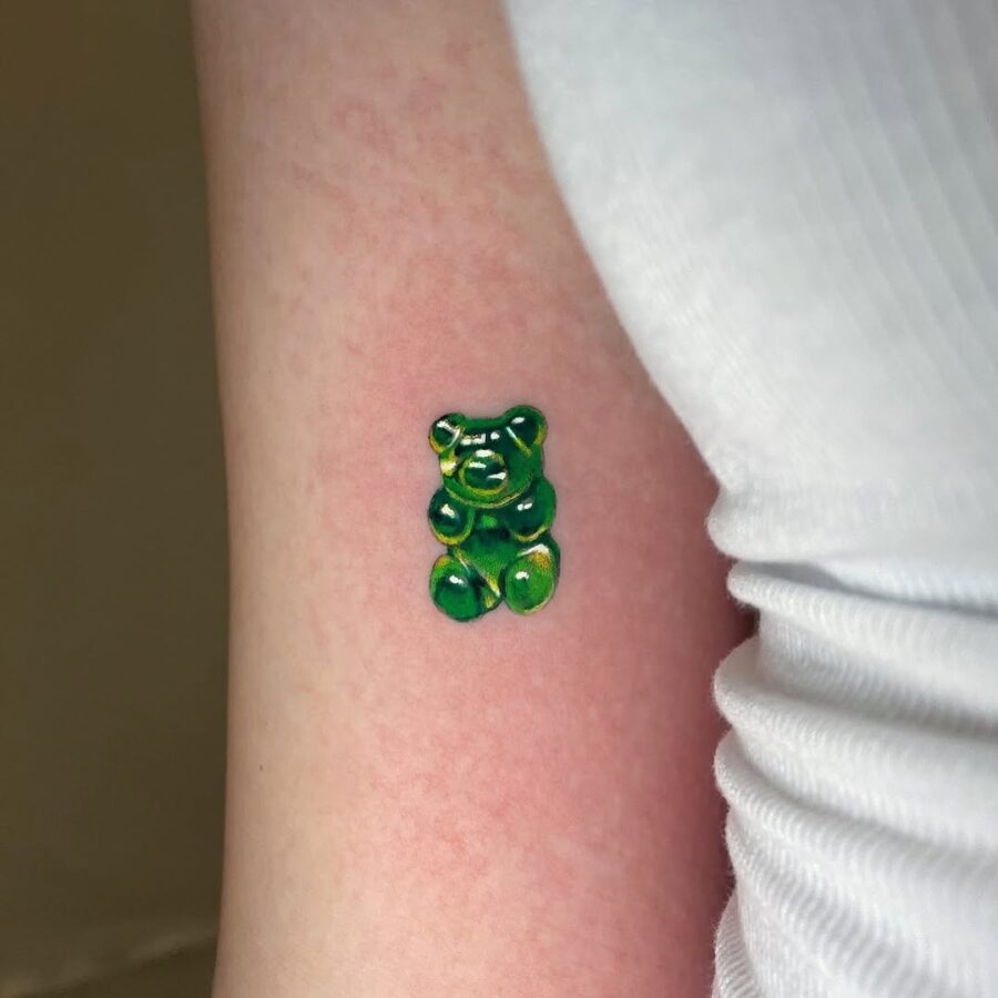 Vibrant gummy bear tattoo in green hues Tattoo on skin