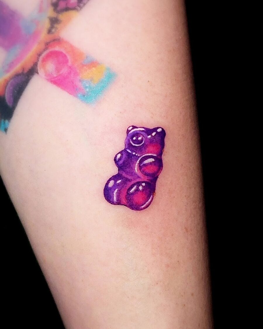 Vivid purple gummy bear tattoo on arm Tattoo on skin