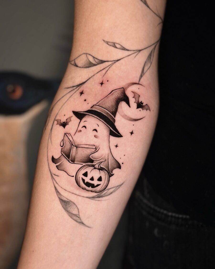 Charming ghost with a witch hat tattoo Tattoo on skin