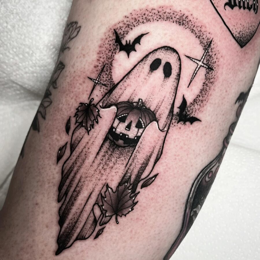 Spooky Ghost with Pumpkin Tattoo Design Tattoo on skin