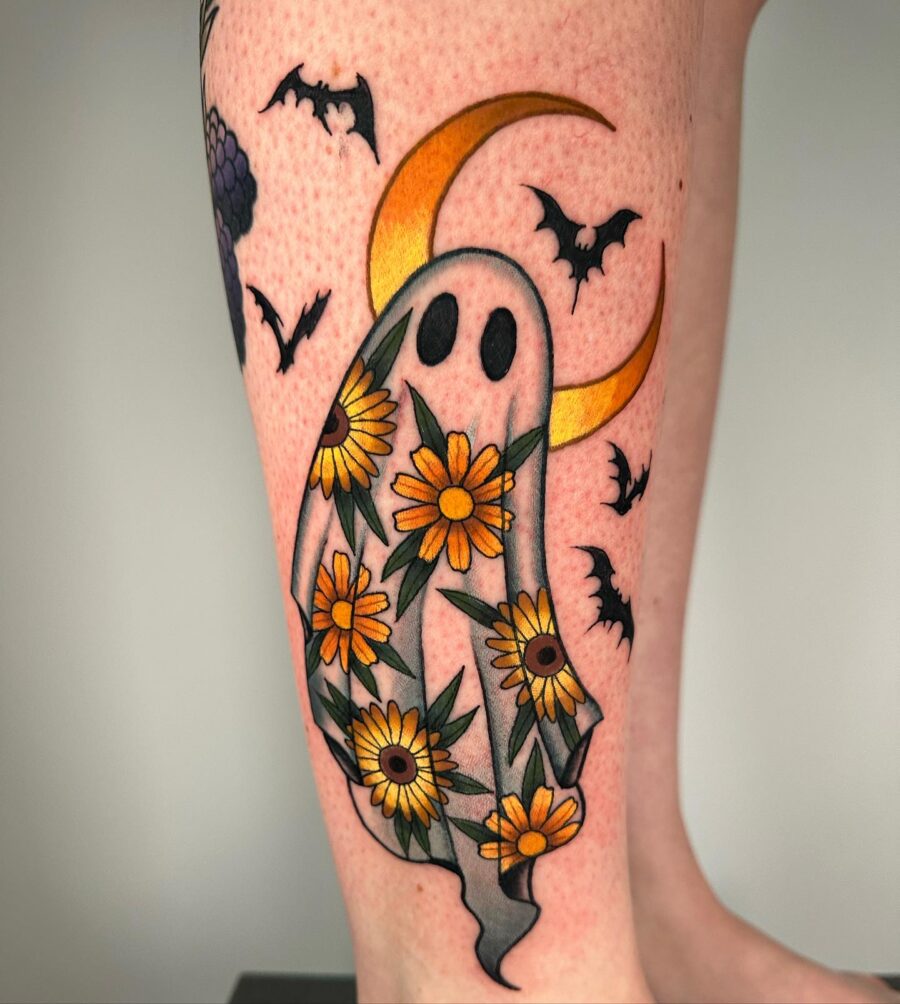 Whimsical ghost tattoo with sunflowers and bats Tattoo on skin