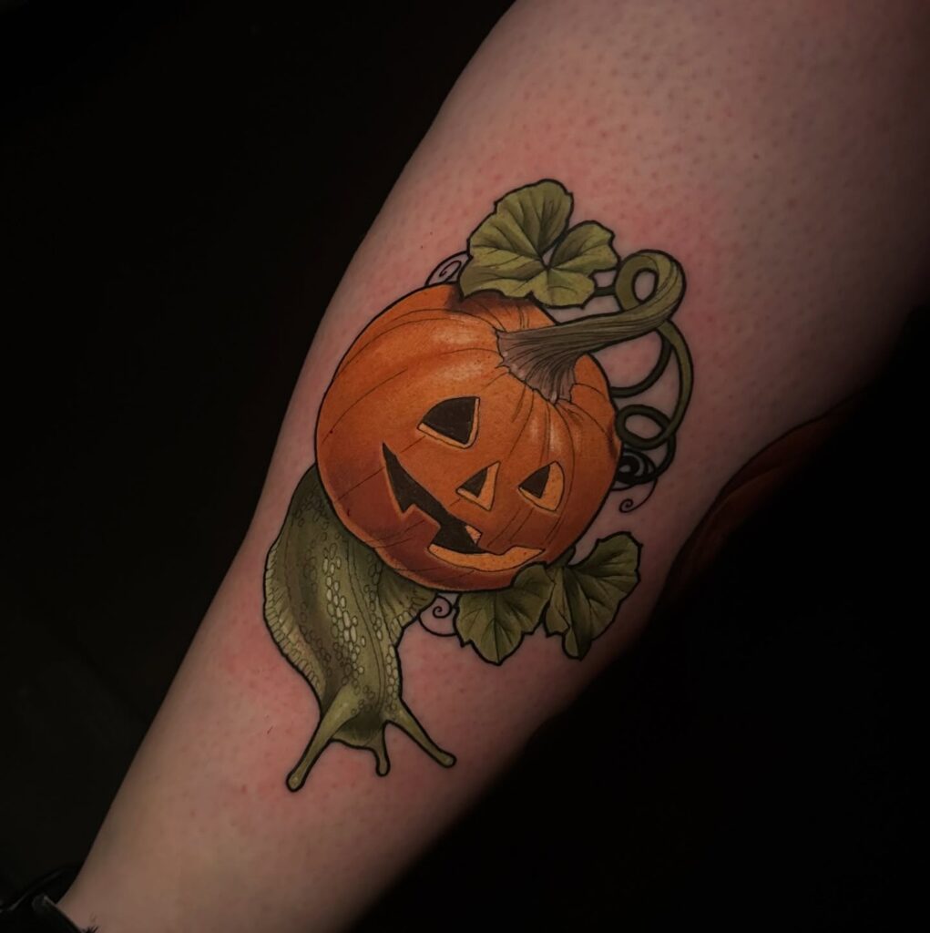 Jack-O -Lantern With Creeping Slug Tattoo halloween tattoos