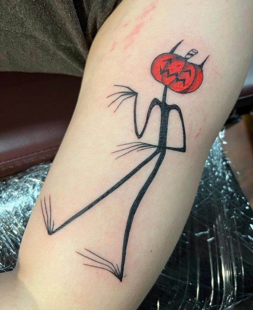 Minimalist Pumpkin-Head Figure Tattoo halloween tattoos