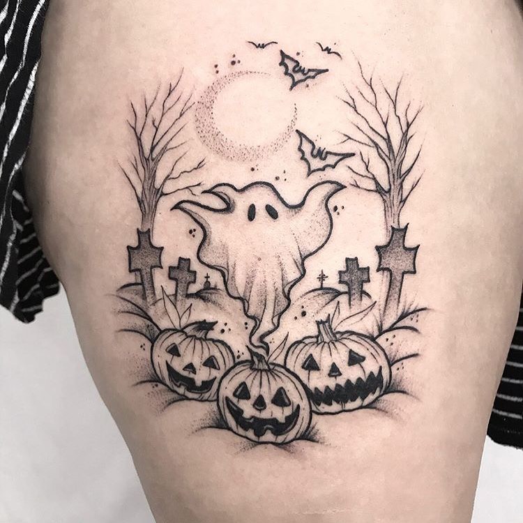 Playful Ghost In A Pumpkin Graveyard Tattoo halloween tattoos