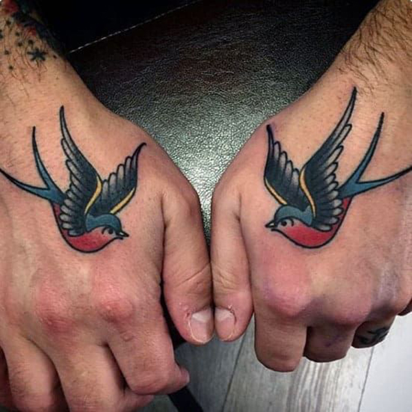 Colorful Twin Swallows Hand Tattoos Tattoo on skin