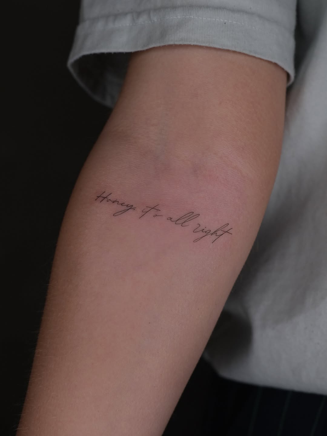 Elegant cursive tattoo with a heartfelt message Tattoo on skin
