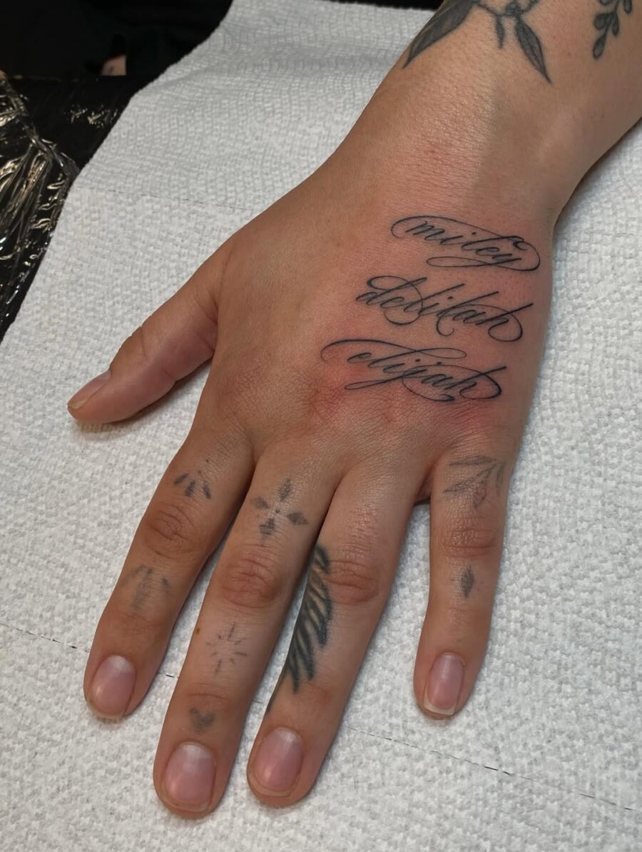 Elegant Handwriting Tattoo on the Hand Tattoo on skin