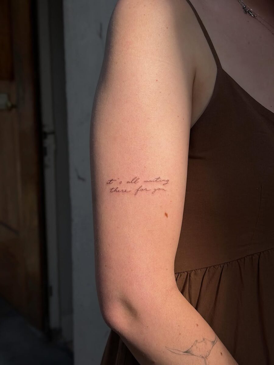 Elegant handwriting tattoo with heartfelt message Tattoo on skin