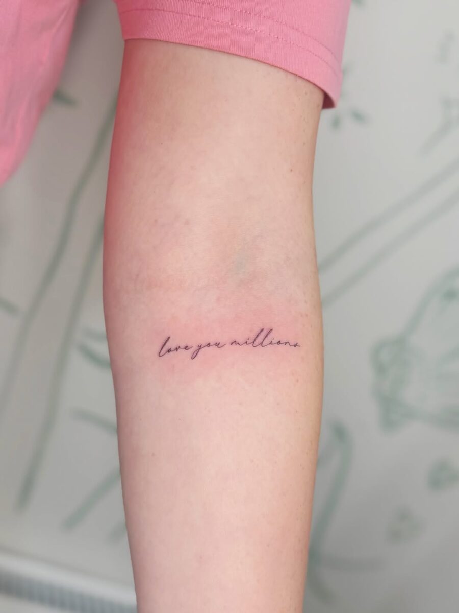Elegant handwritten love letter tattoo style Tattoo on skin