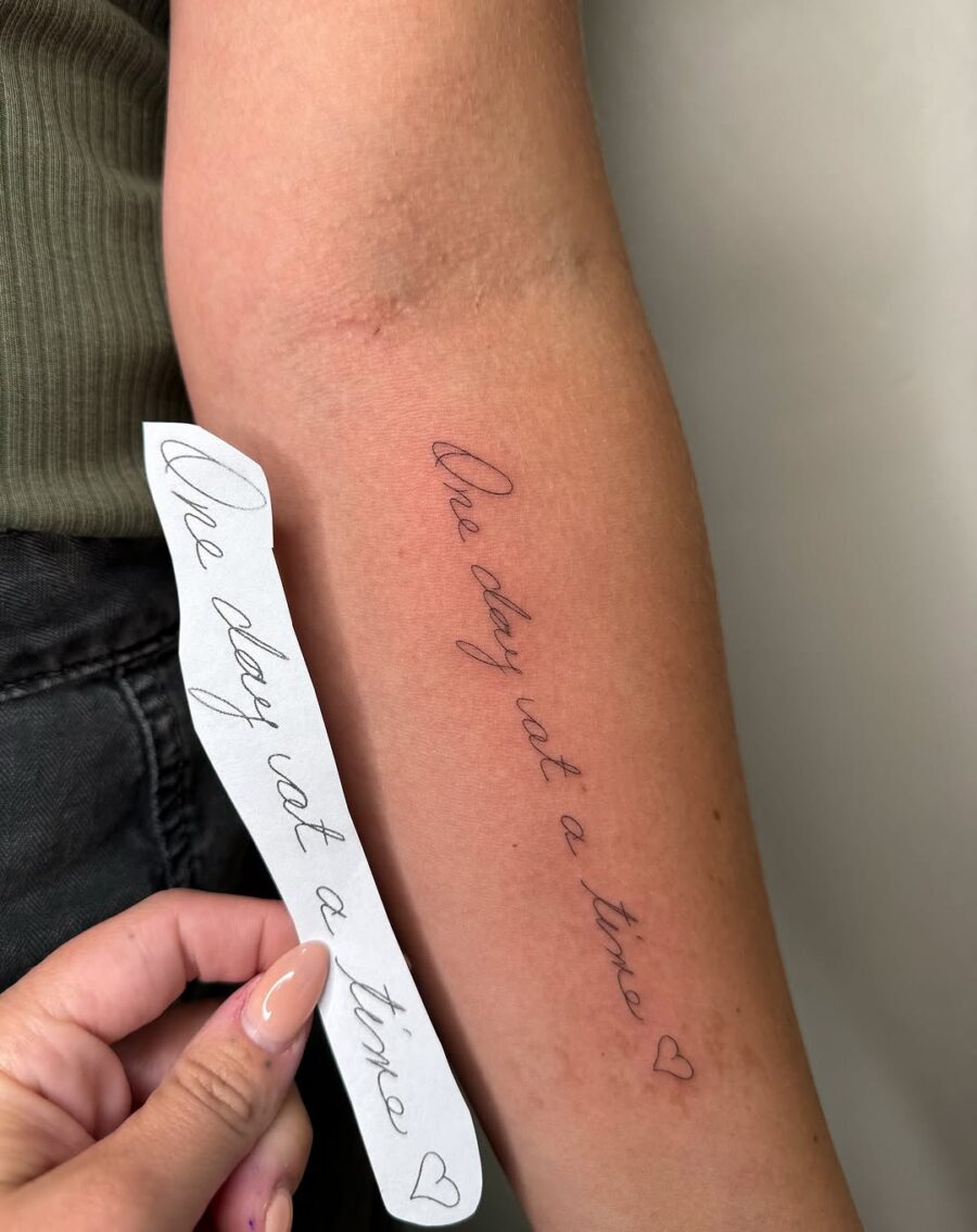 Minimalist Handwriting Tattoo Inspiring Serenity Tattoo on skin
