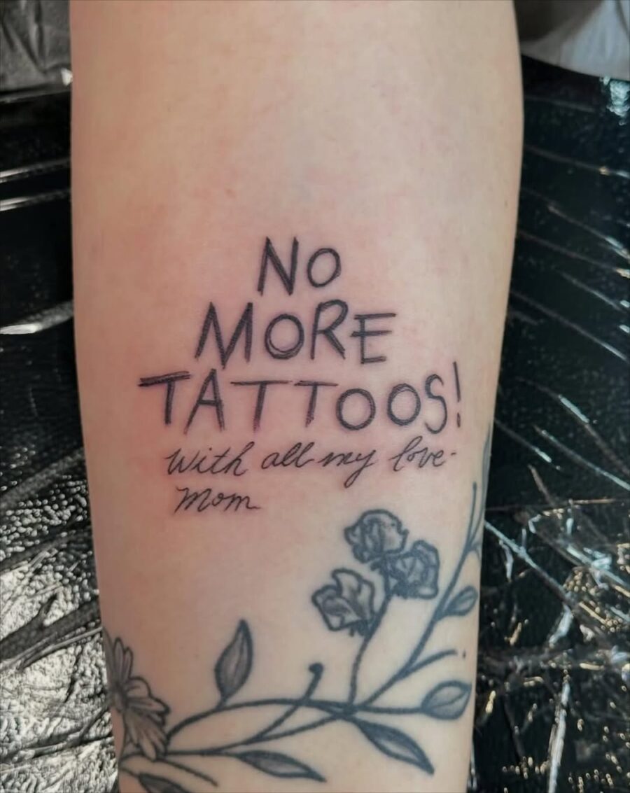 Stylish Handwritten Message with Floral Details Tattoo on skin