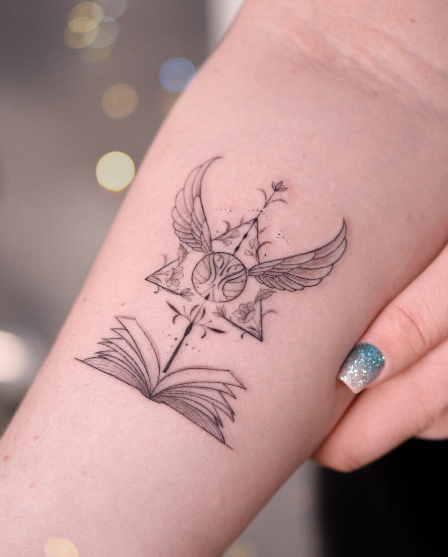 Elegant tattoo combining magic and literature themes Tattoo on skin