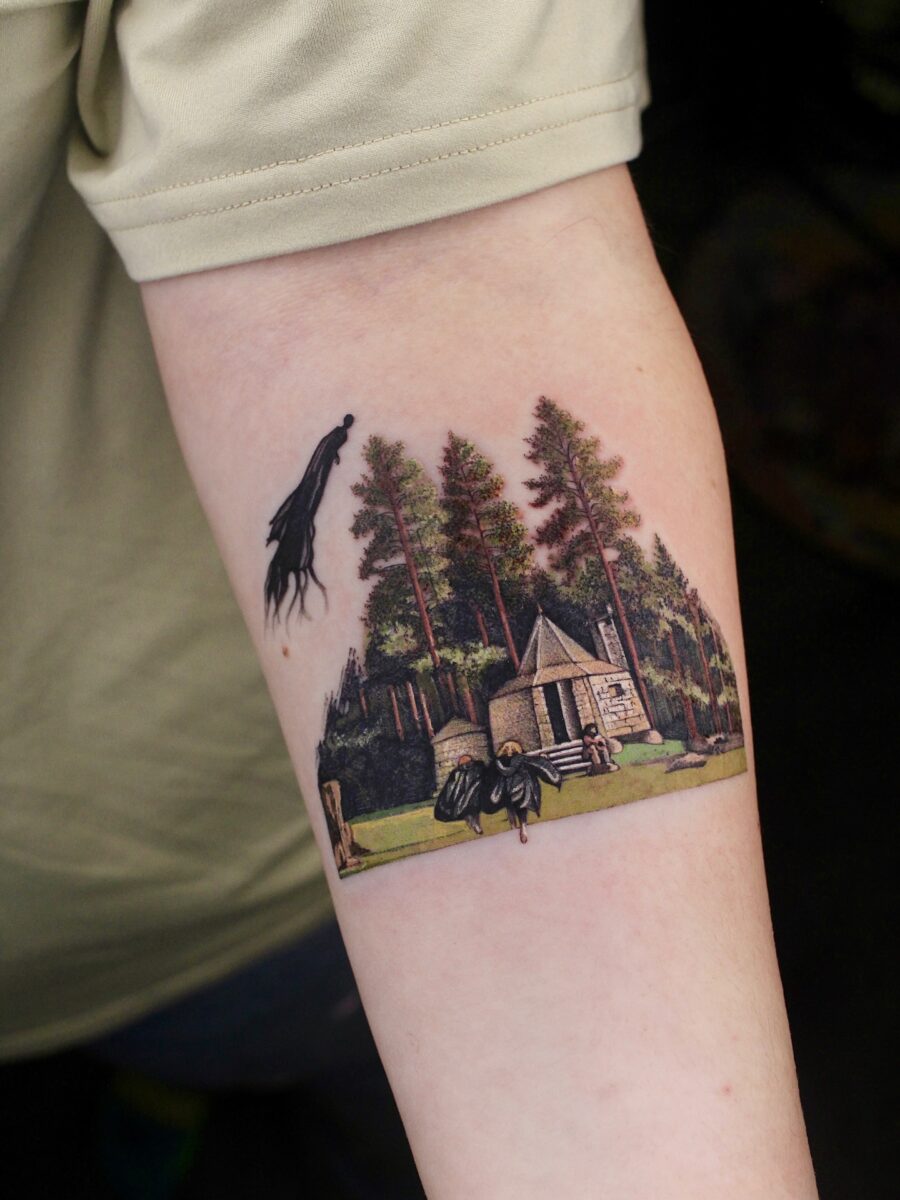 Hagrid's Hut Tattoo Surrounded by Enchanted Forest Tattoo on skin