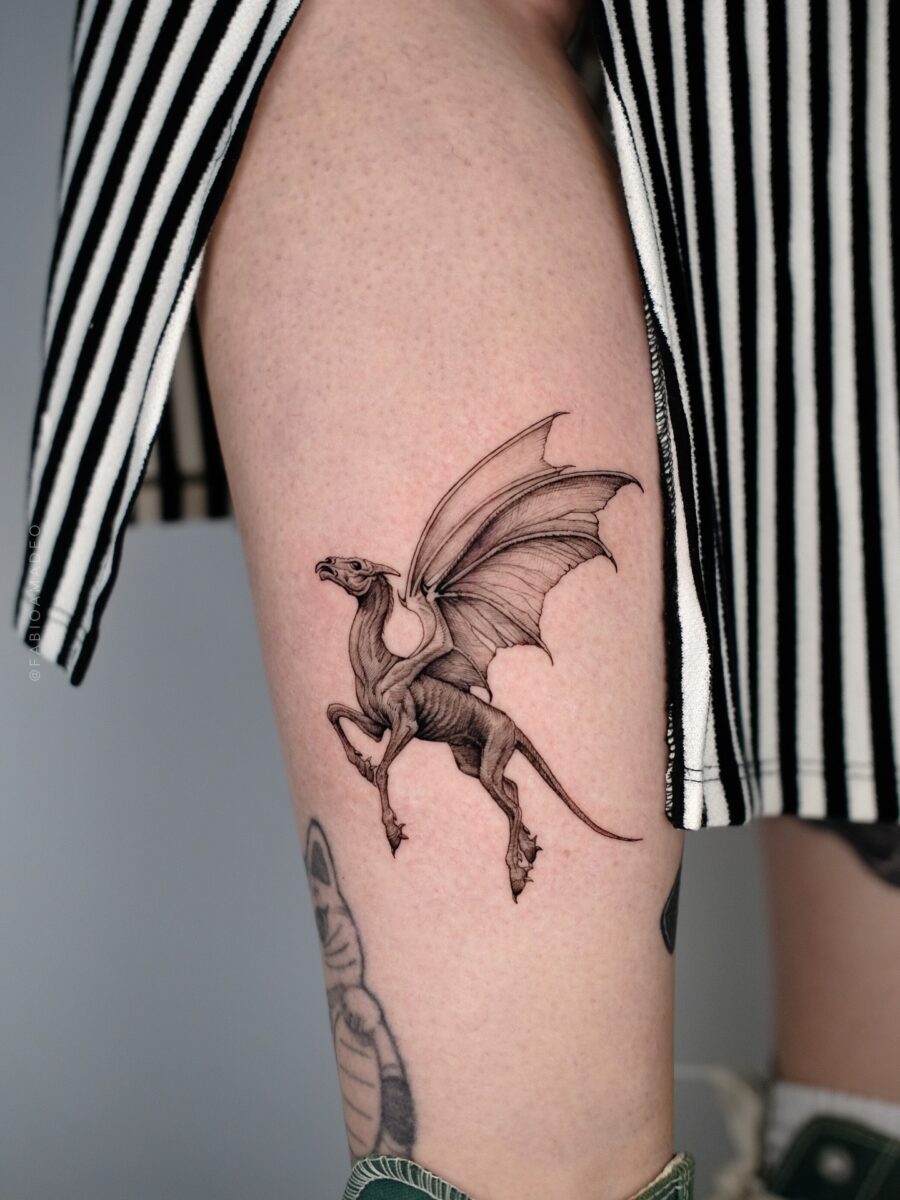 Intricate depiction of a magical creature tattoo Tattoo on skin