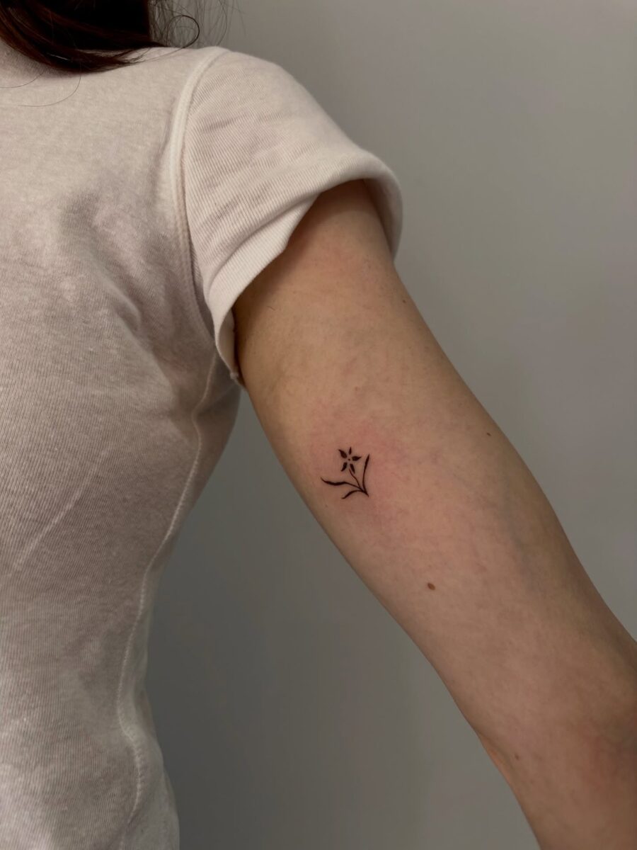 Delicate floral tattoo on the inner arm Tattoo on skin