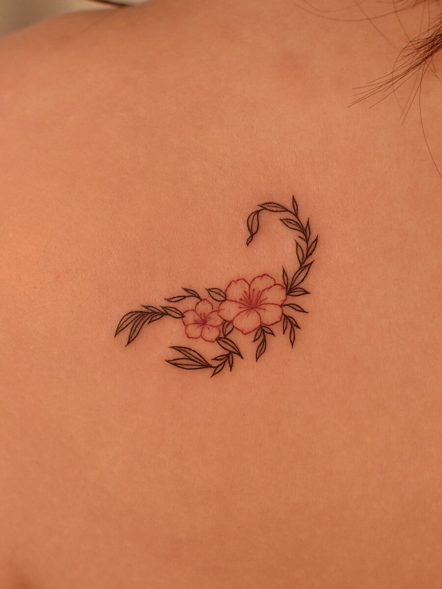 Elegant floral swan tattoo on the back Tattoo on skin