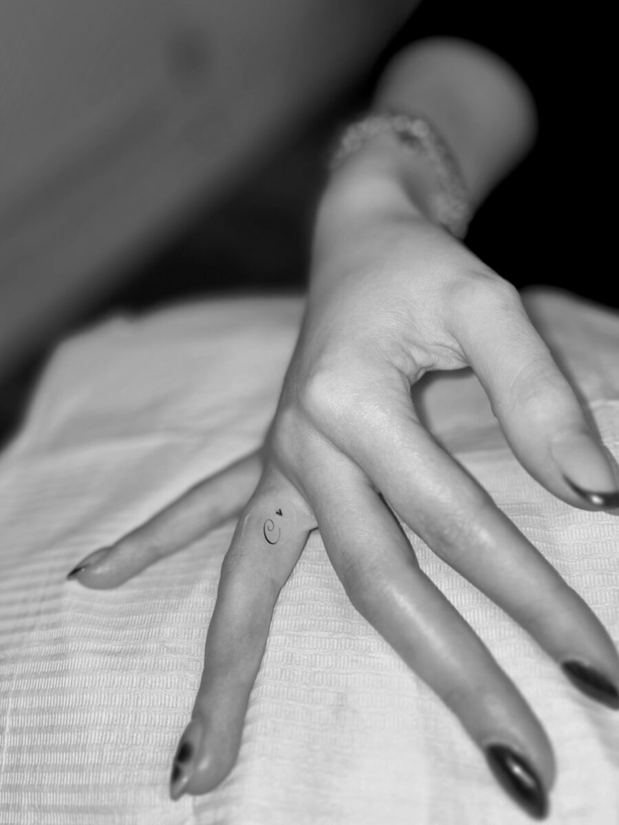 Subtle elegance with hidden finger tattoos Tattoo on skin