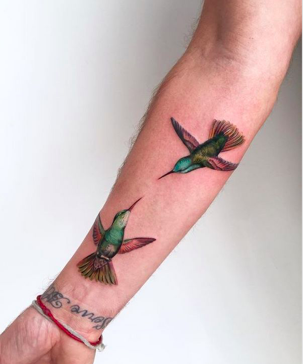 Colorful Conversing Hummingbird Tattoo Design Tattoo on skin