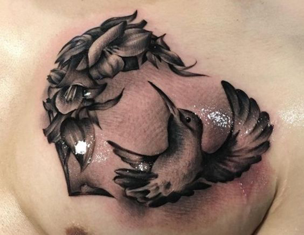 Heart-Shaped Hummingbird Tattoo Featuring a Floral Wreath Tattoo on skin