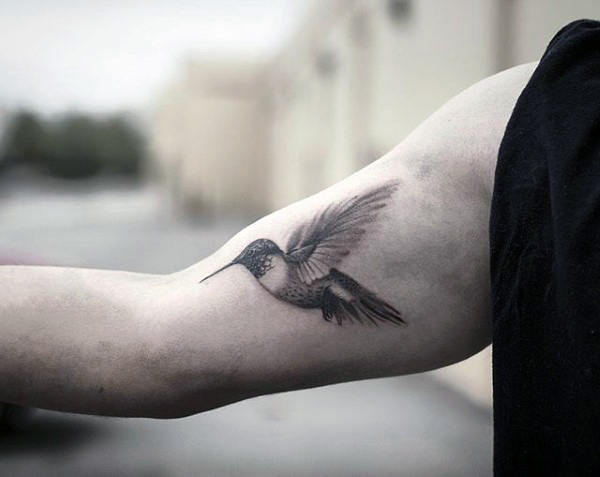 Hummingbird Tattoo with Dancing Wings Tattoo on skin