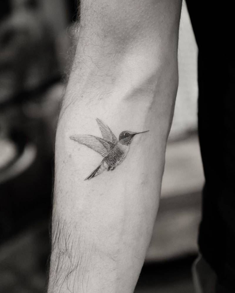 Incredibly Detailed Small Hummingbird Tattoo Tattoo on skin