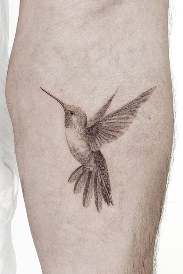 Realistic Hummingbird Tattoo with Artistic Flair Tattoo on skin