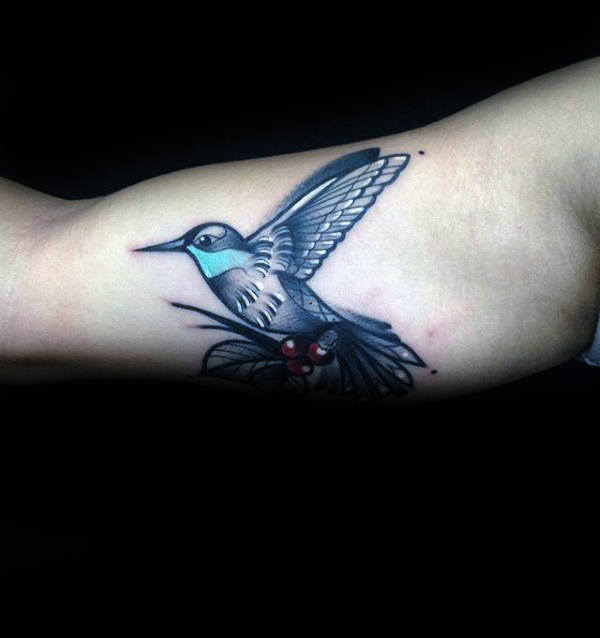 Stylized Blue and White Hummingbird Bicep Tattoo Tattoo on skin