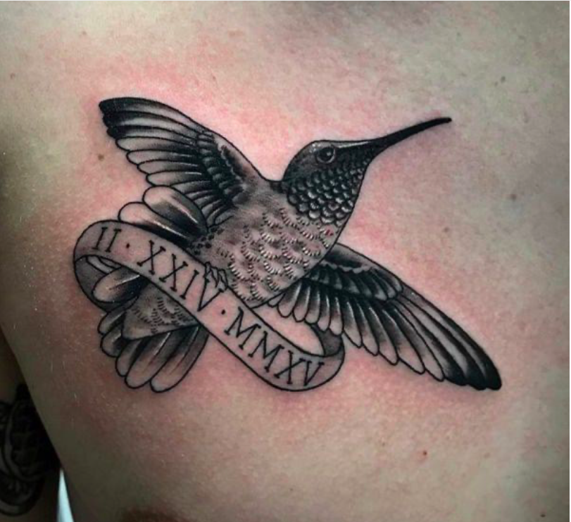 Uplifting Black & White Hummingbird with a Banner Tattoo on skin