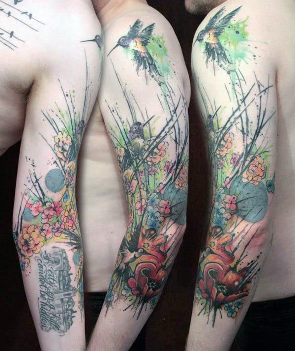 Watercolor Hummingbird Tattoo with a Woodland Scene Tattoo on skin