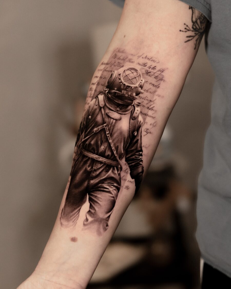 Stunning Diver Tattoo with Lyrical Background Tattoo on skin