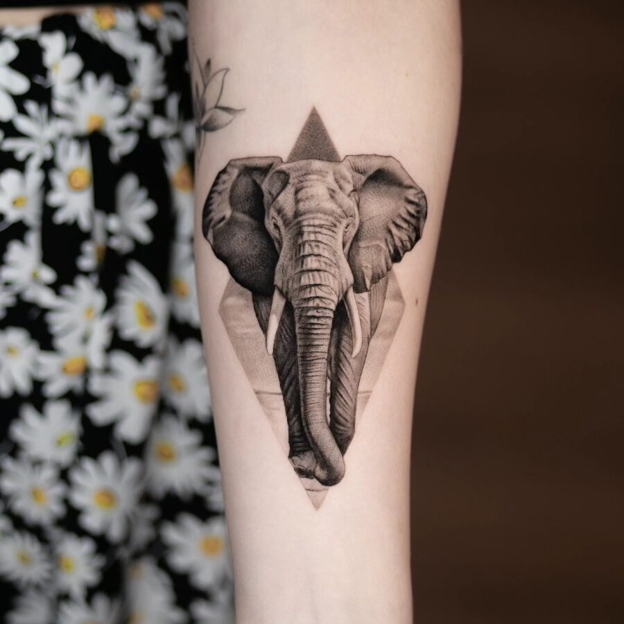 Stunning Elephant Tattoo with Geometric Elements Tattoo on skin