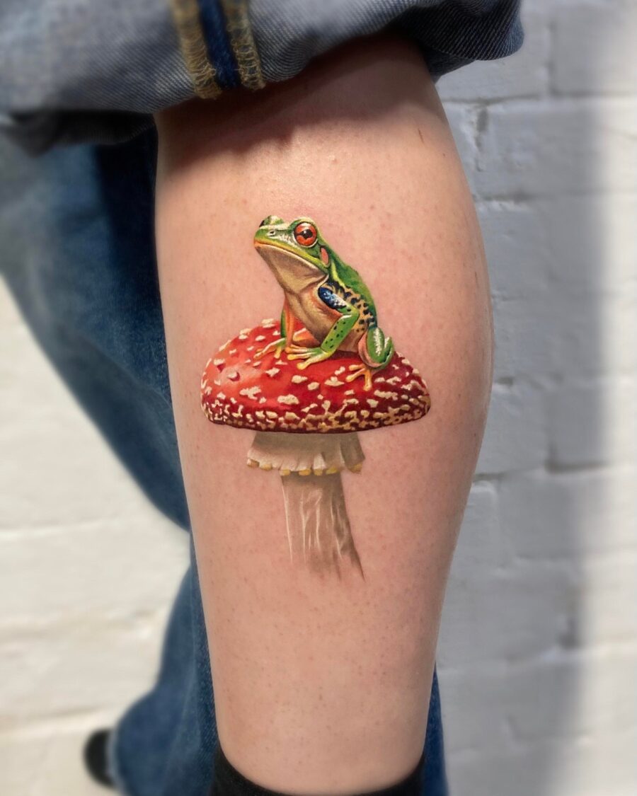 Stunningly realistic frog on a mushroom tattoo Tattoo on skin
