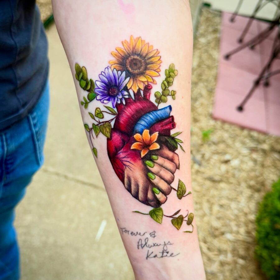 A vibrant tribute tattoo with floral elements Tattoo on skin