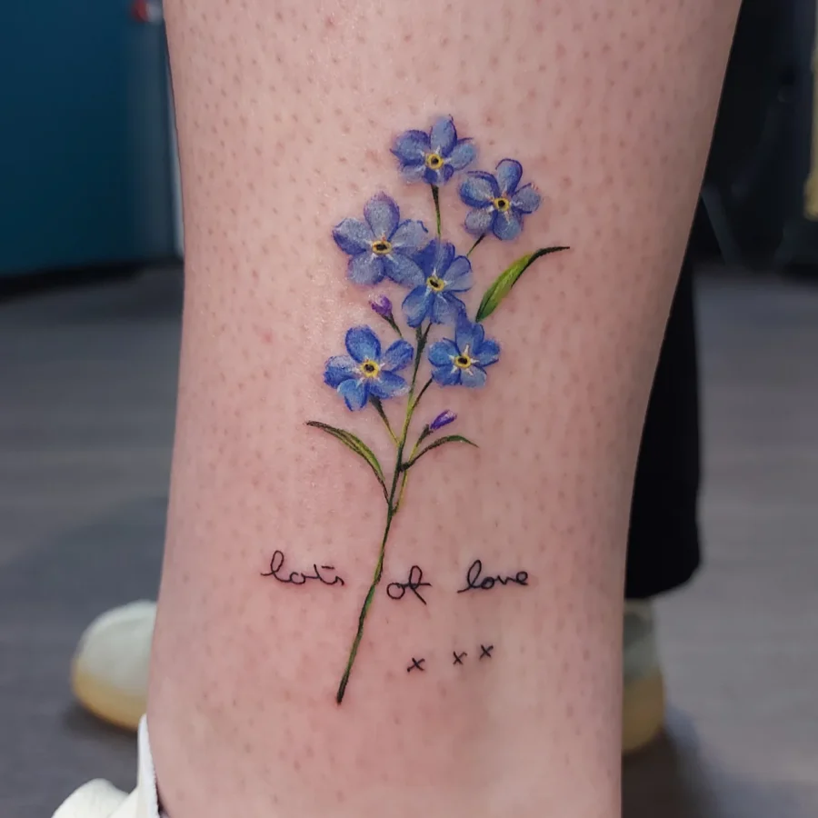 Elegant forget-me-not floral tattoo with sentiment Tattoo on skin